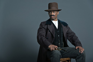 Retro afro america western cowboy man with mustache. Sitting in