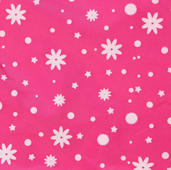 Pink texture with white snowflakes.