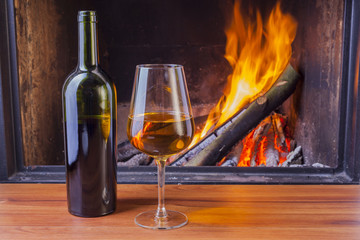 snacks and wine at cozy fireplace