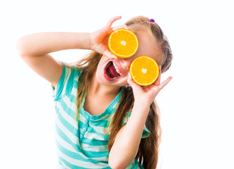 little girl with oranges