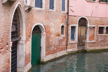 Fototapeta na wymiar Weathered back street in Venice Italy