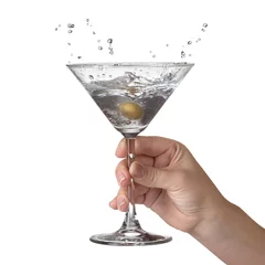 Fototapeten Martini with splash and olive in womans hand isolated on white © artjazz