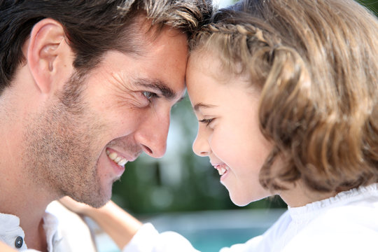 Father and daughter looking at each other