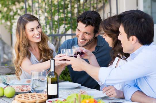 Group Of Friends Toasting Wine Glass