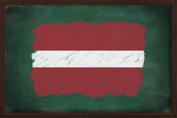 Latvia flag painted with chalk on blackboard