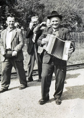 Joy at the railway station (man with accordion) - circa 1955