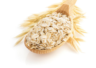 oat flakes in spoon on white