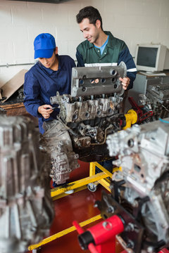 Trainee and instructor checking engine