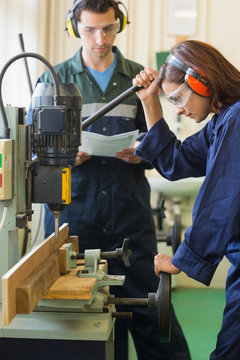 Focused trainee using drill