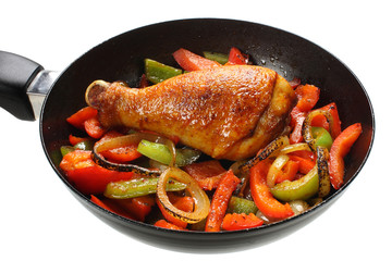 Fried chicken leg with paprika and onion