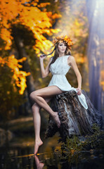 portrait of beautiful girl in the forest. girl with fairy look