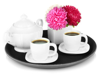 Cups of coffee on tray isolated on white