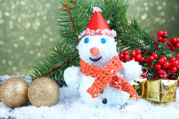 Fototapeta na wymiar Beautiful snowman and Christmas decor, on bright background