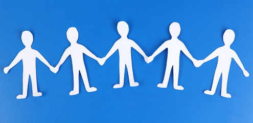 Paper people in social network concept on blue background