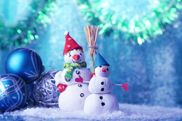 Beautiful snowmen and Christmas decor, on bright background
