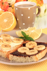 Delicious toast with bananas on plate close-up