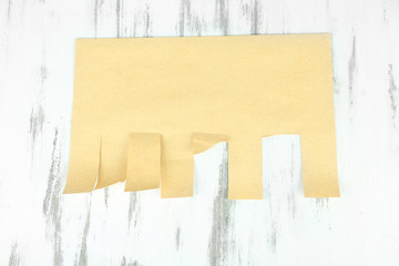 Paper for ads on wooden background