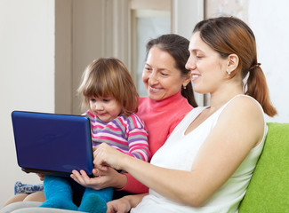  Happy family  with laptop