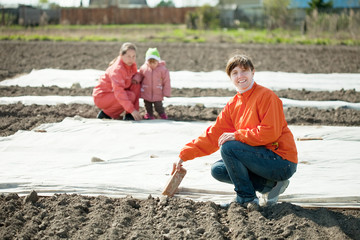 family covers  soil a polyethylene film