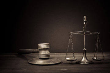 Law scales, judge gavel on table. Symbol of justice