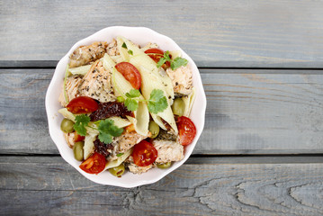 Salmon salad on wooden table