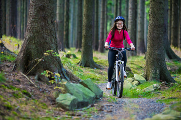 Naklejka premium Healthy lifestyle - teenage girl biking