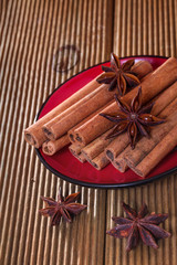 Cinnamon with anise on a wooden background