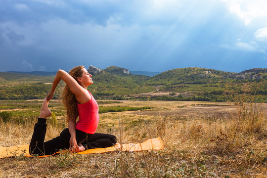 Outdoor yoga practice in mountain