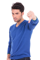 man making the thumbs down negative hand sign