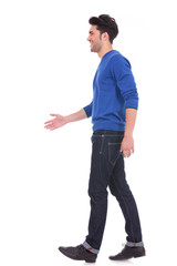 Fototapeta premium casual man in blue jeans and shirt walking