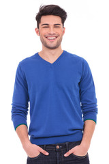 Fototapeta premium young casual man with hands in pockets smiling