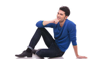 pensive young man sitting