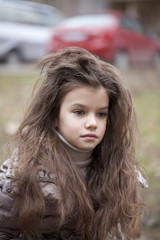 Fototapeta premium Autumn portrait of a beautiful little girl