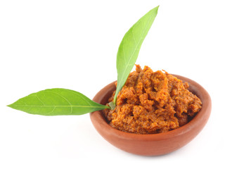 Turmeric with Henna leaves over white background