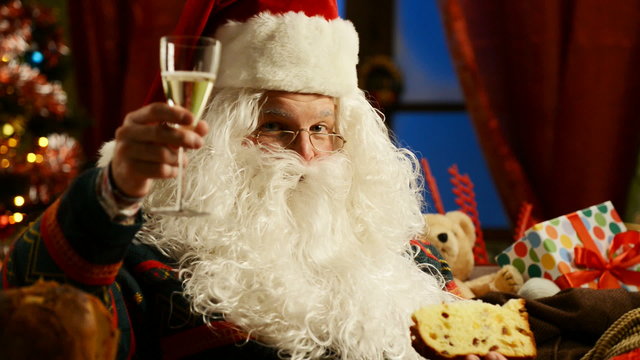 Santa Claus celebrating with champagne