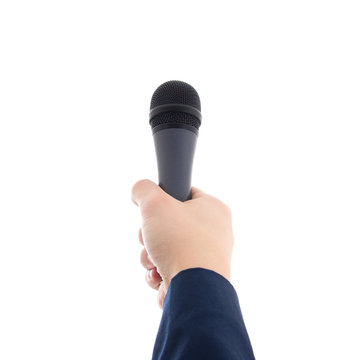 hand holding a microphone isolated on white
