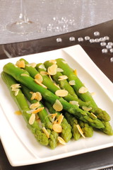 Roasted asparagus with almonds on a Christmas table
