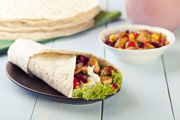 tortilla wraps with meat and vegetables