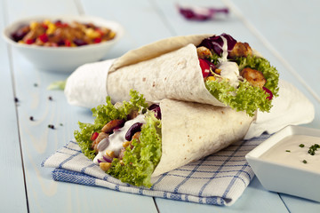 tortilla wraps with meat and vegetables