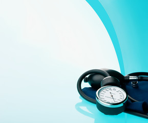 Sphygmomanometer on blue, reflective background