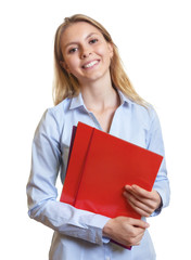 Female secretary with colorful paperwork laughing at camera