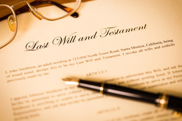 Last will and testament with pen and glasses concept for legal d