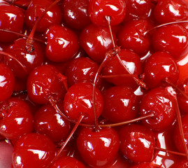 Festive background of red cocktail maraschino cherries - obrazy, fototapety, plakaty