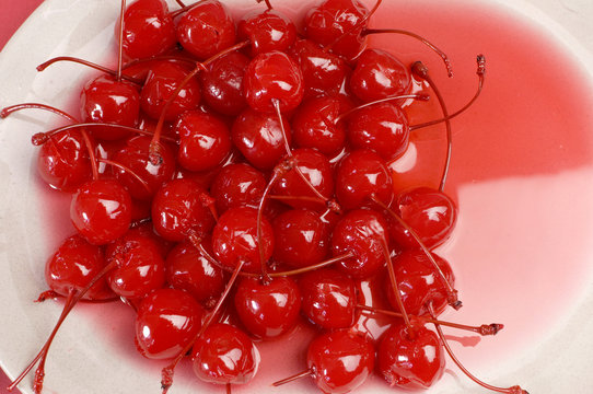 Red cocktail maraschino cherries with stems