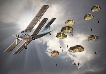 Retro style picture of the biplanes with sky divers.