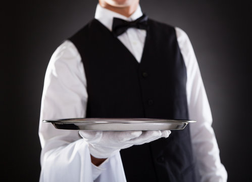 Male Waiter Holding Tray