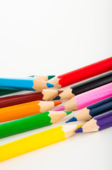 Obraz premium Wooden color pencils on white background