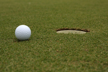 Golf Ball near the cup