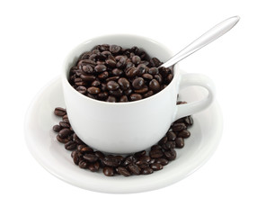 Cup of coffee beans and spoon on white background.
