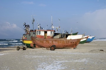 Fototapeta premium Fishing vessels on beach
